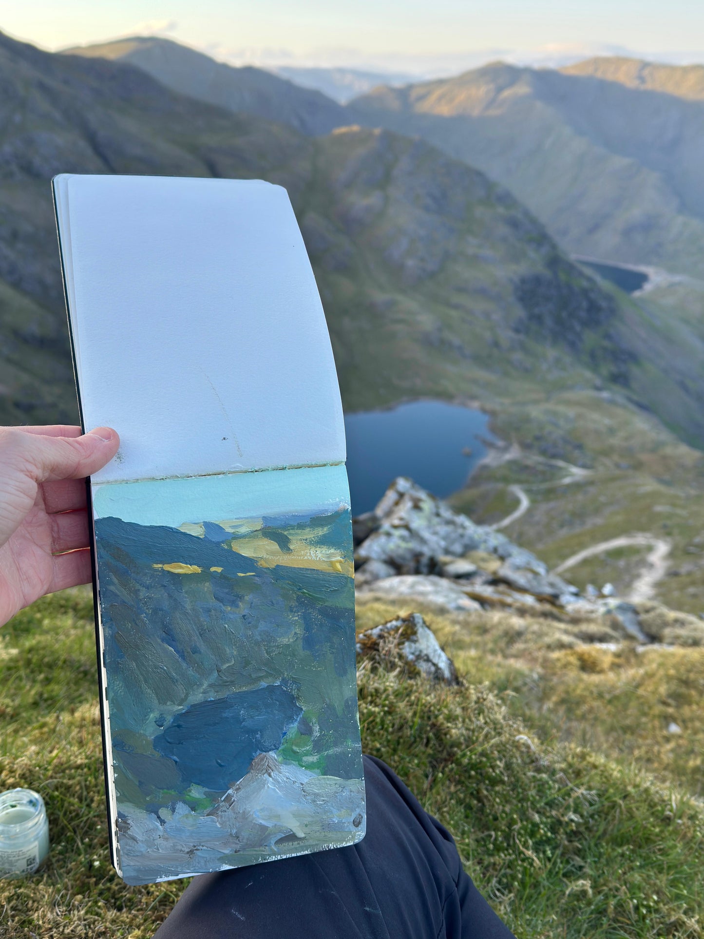 Just catching the evening light at the top of a Lake District pike, a photo of the view and the artwork still in the Moleskine sketchpad.