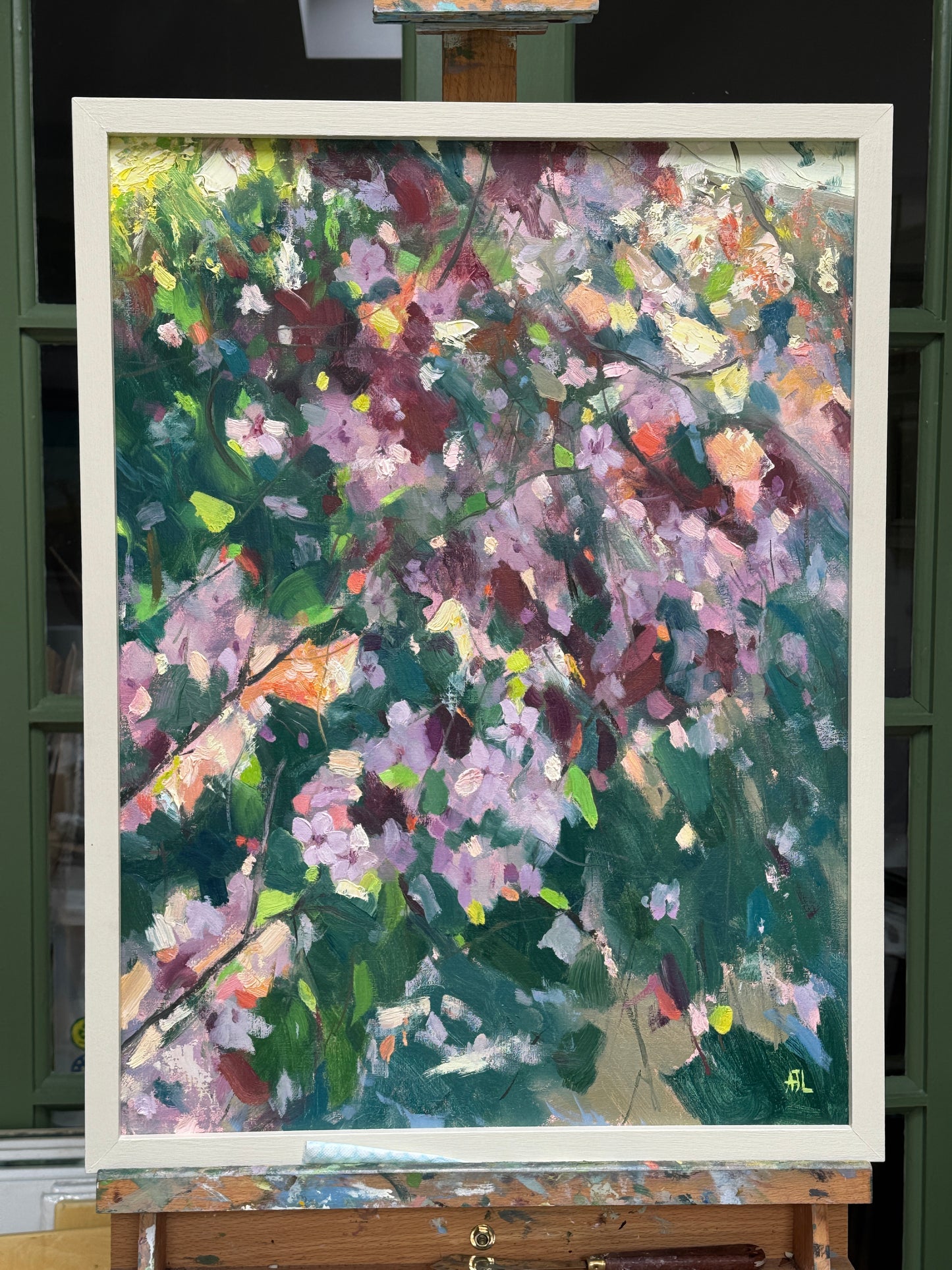 The framed oil painting.