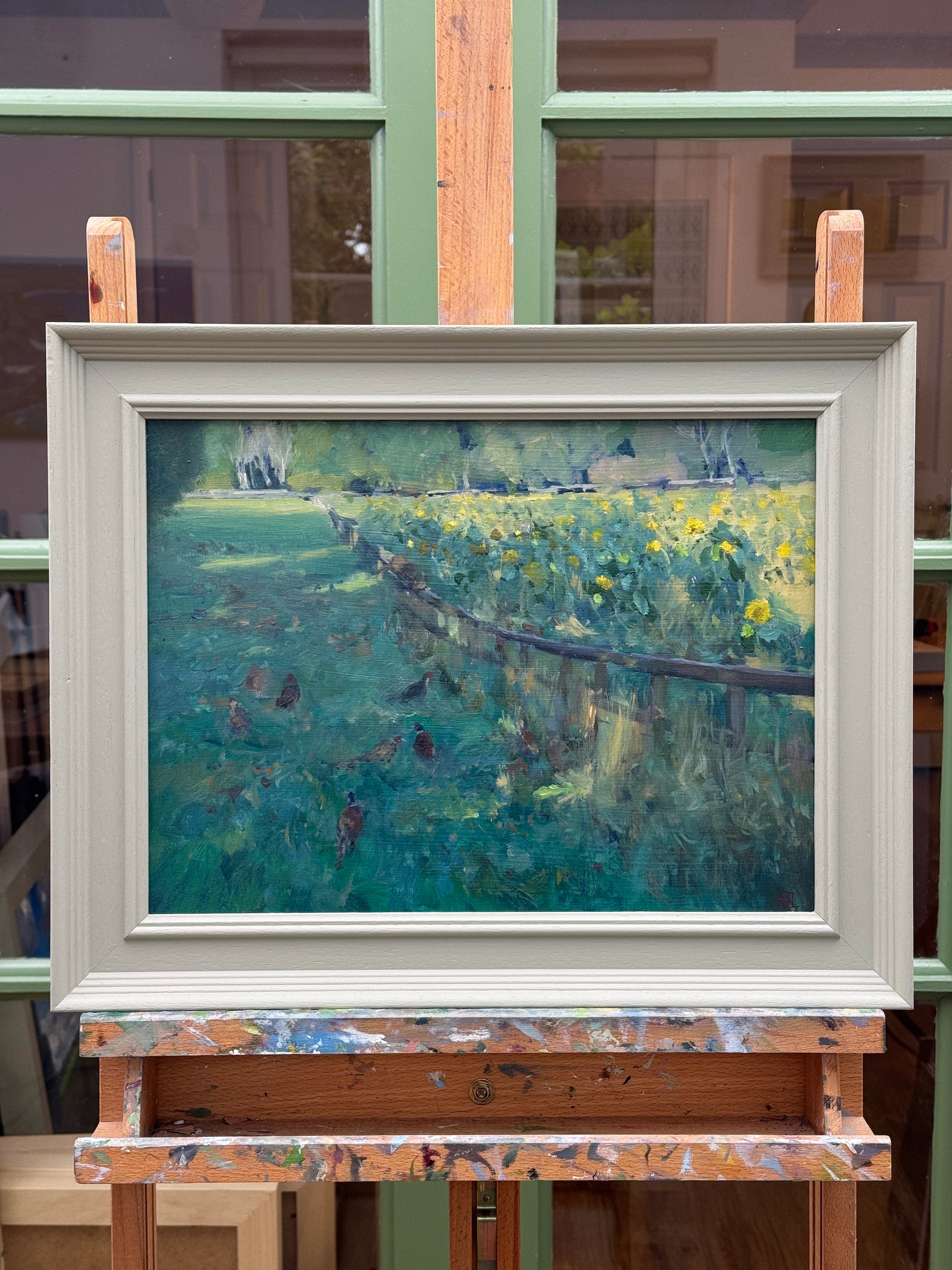 The original oil painting in a wood frame.