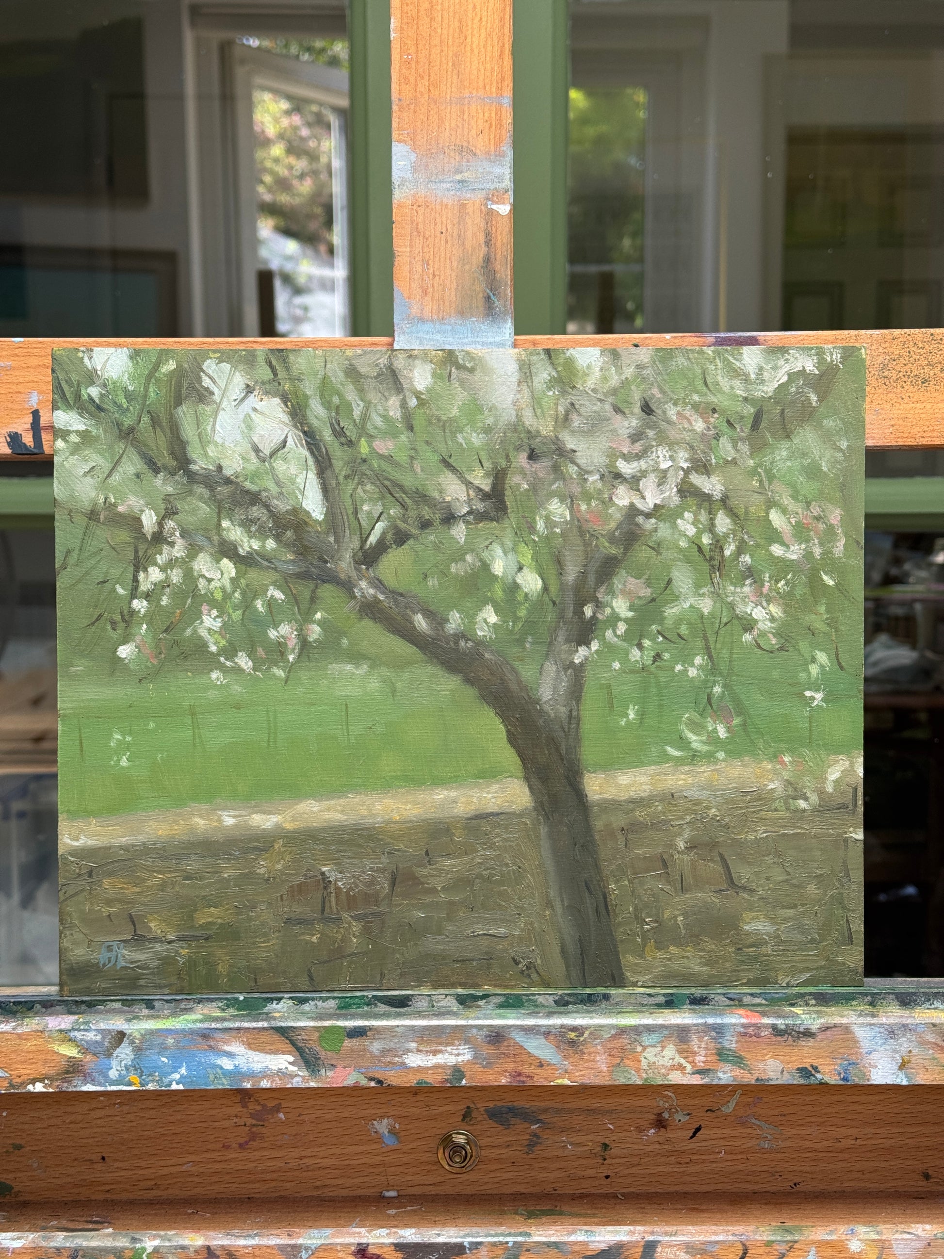 The original oil painting photographed on an artist easel.