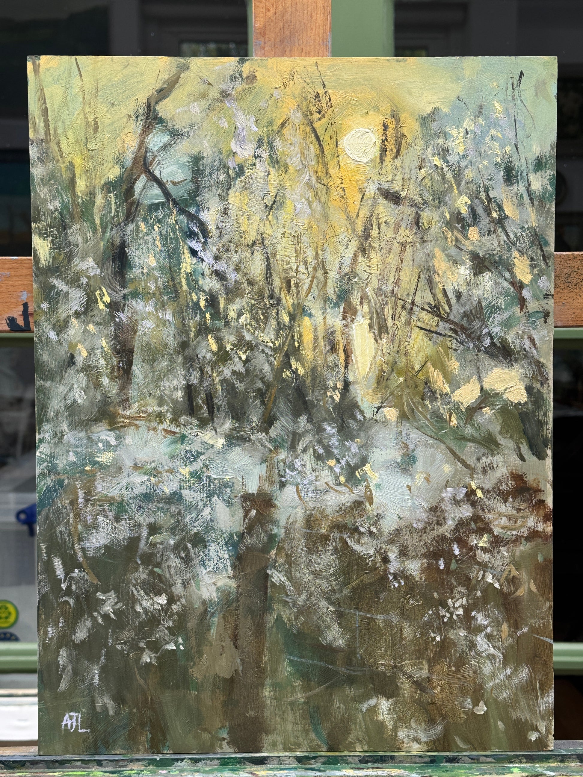 The oil painting on an artist easel.
