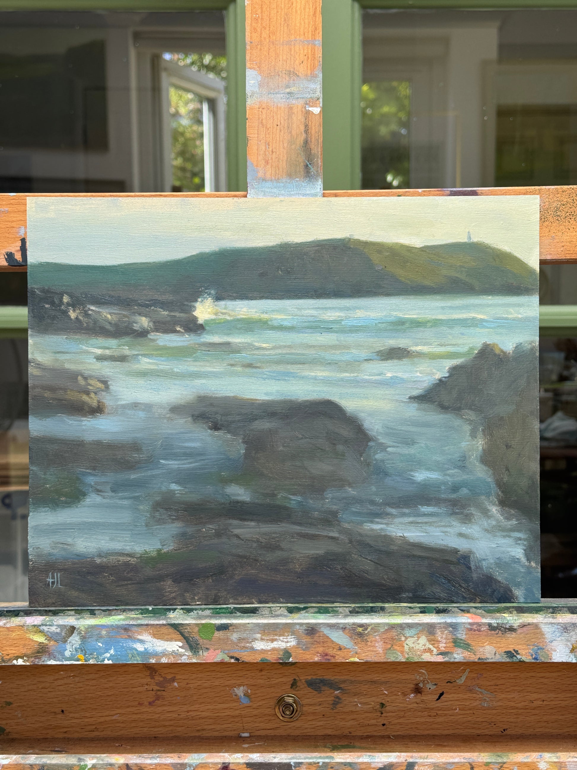 The artwork resting on the artist easel.