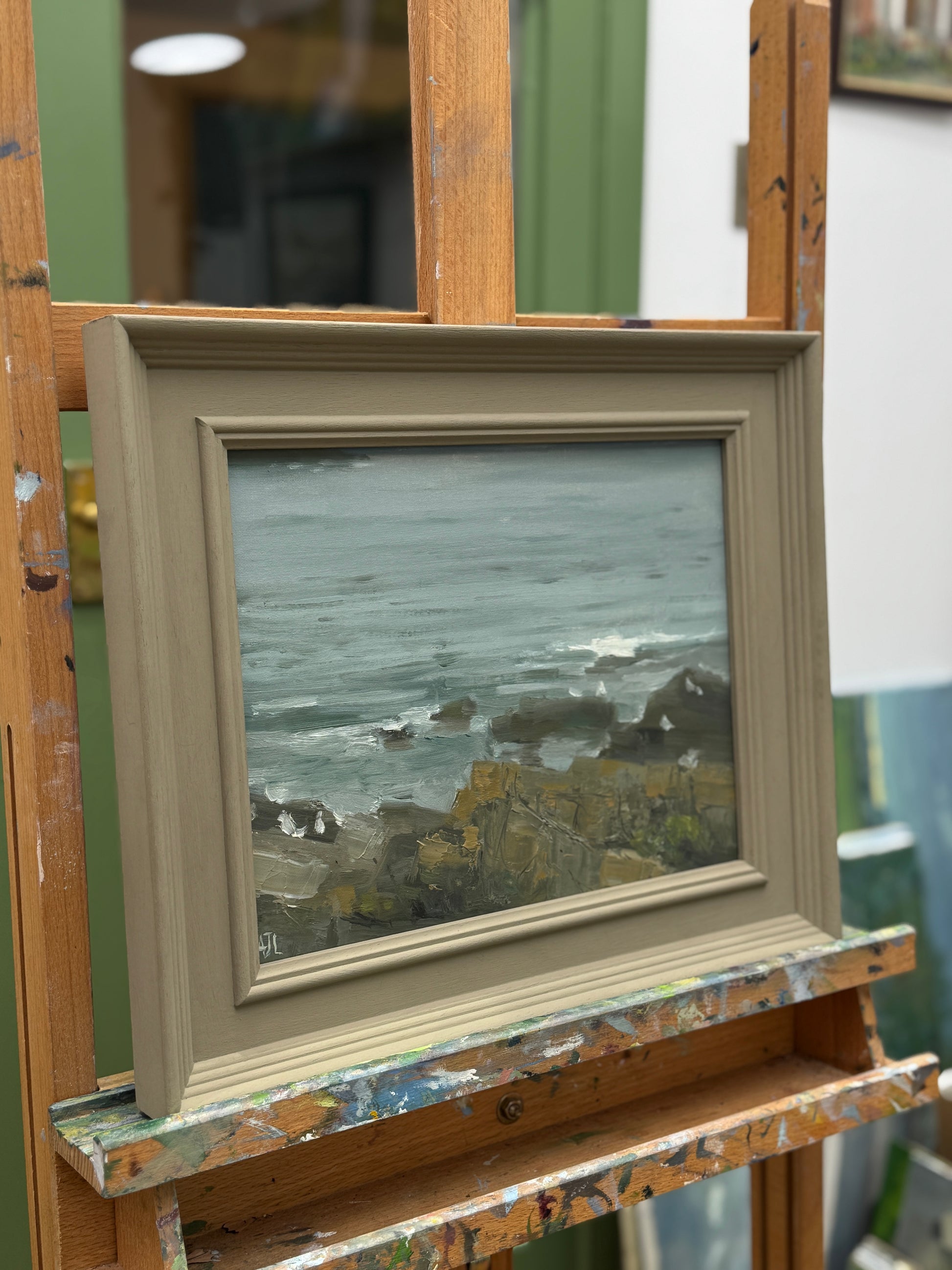 The original artwork framed and on an easel.