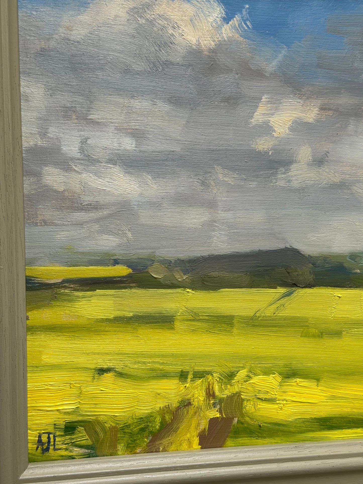 A detail of the oil painting and artist signature.