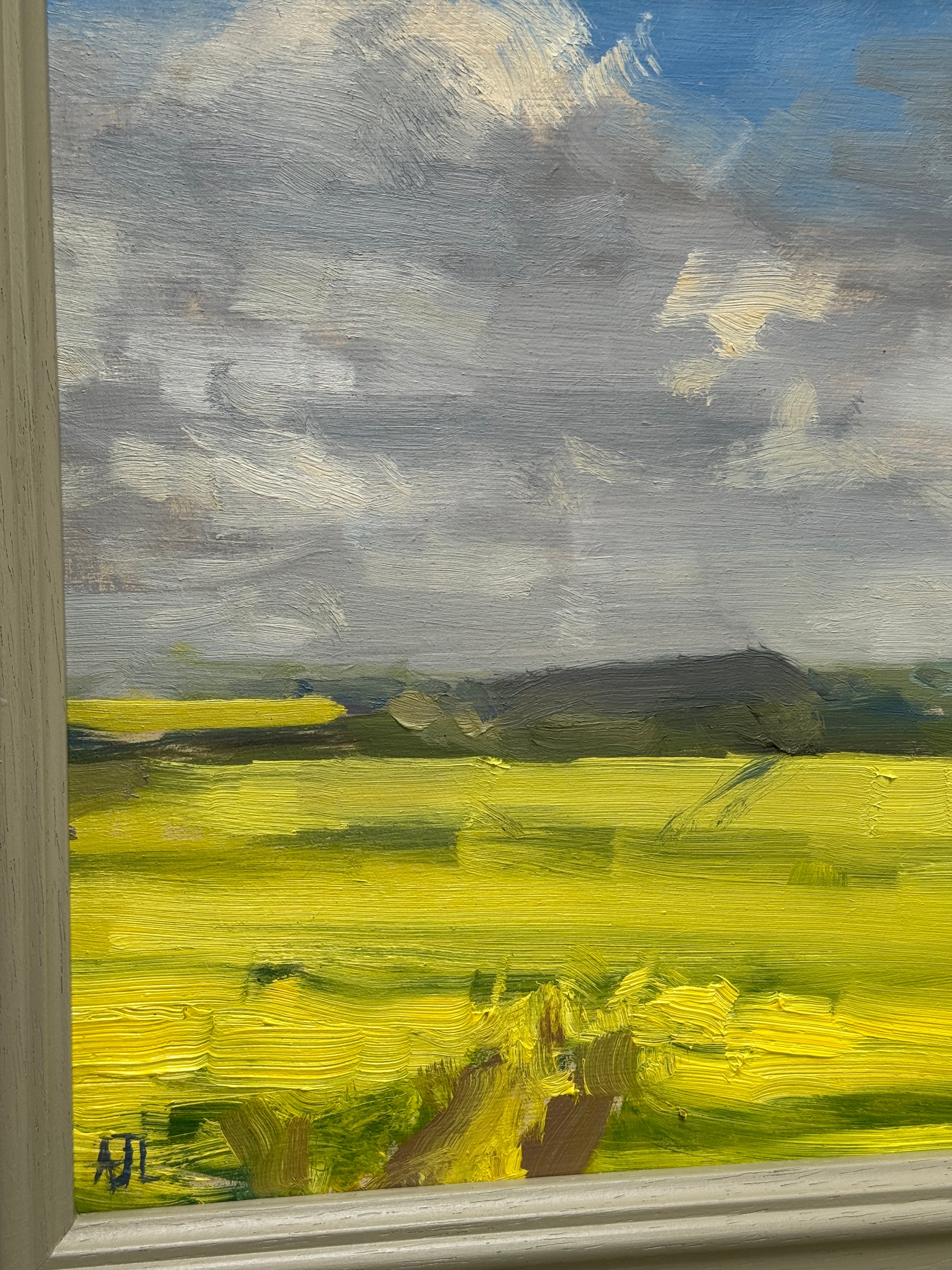 A detail of the oil painting and artist signature.