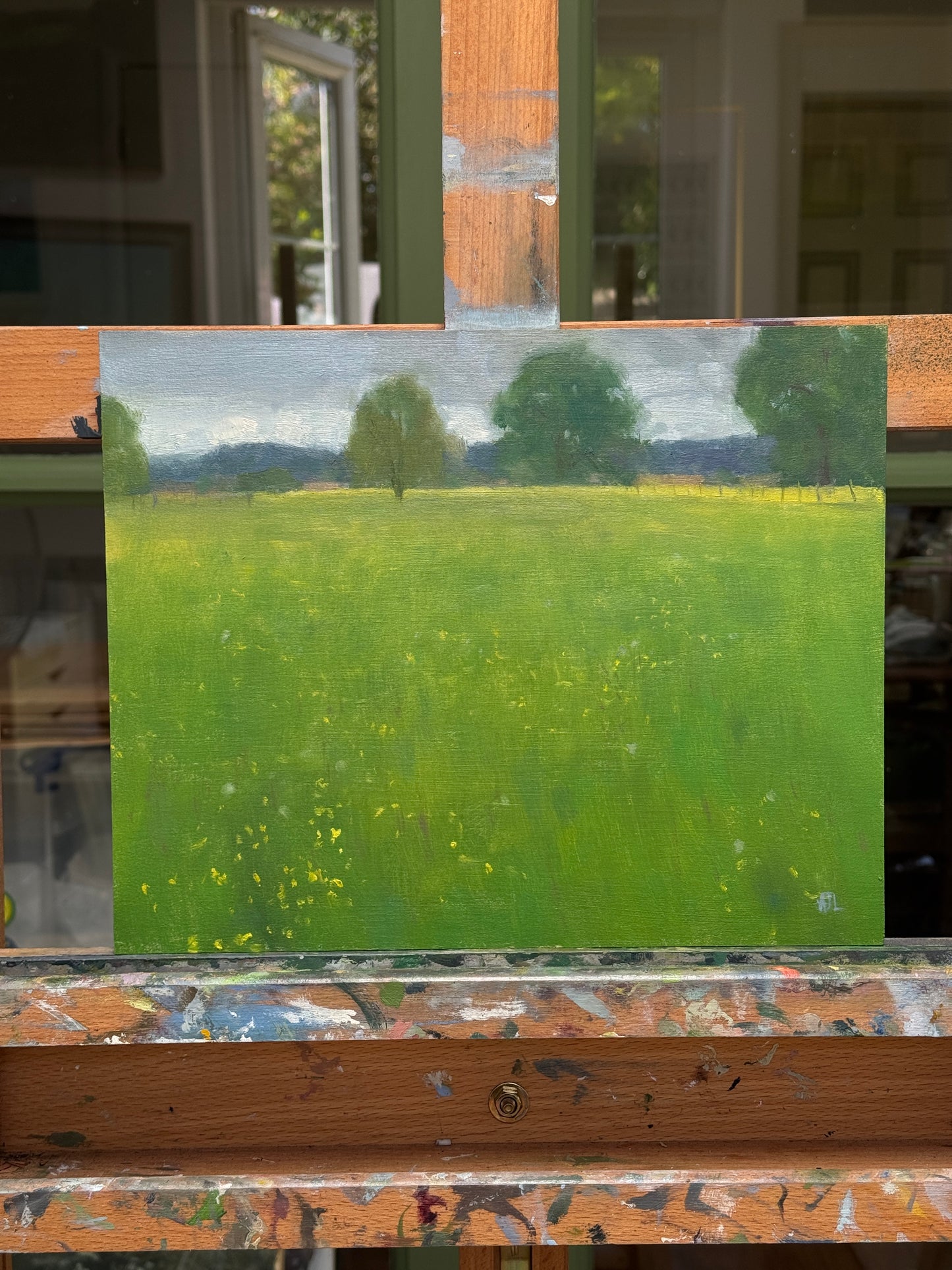 The original painting on the artist easel.