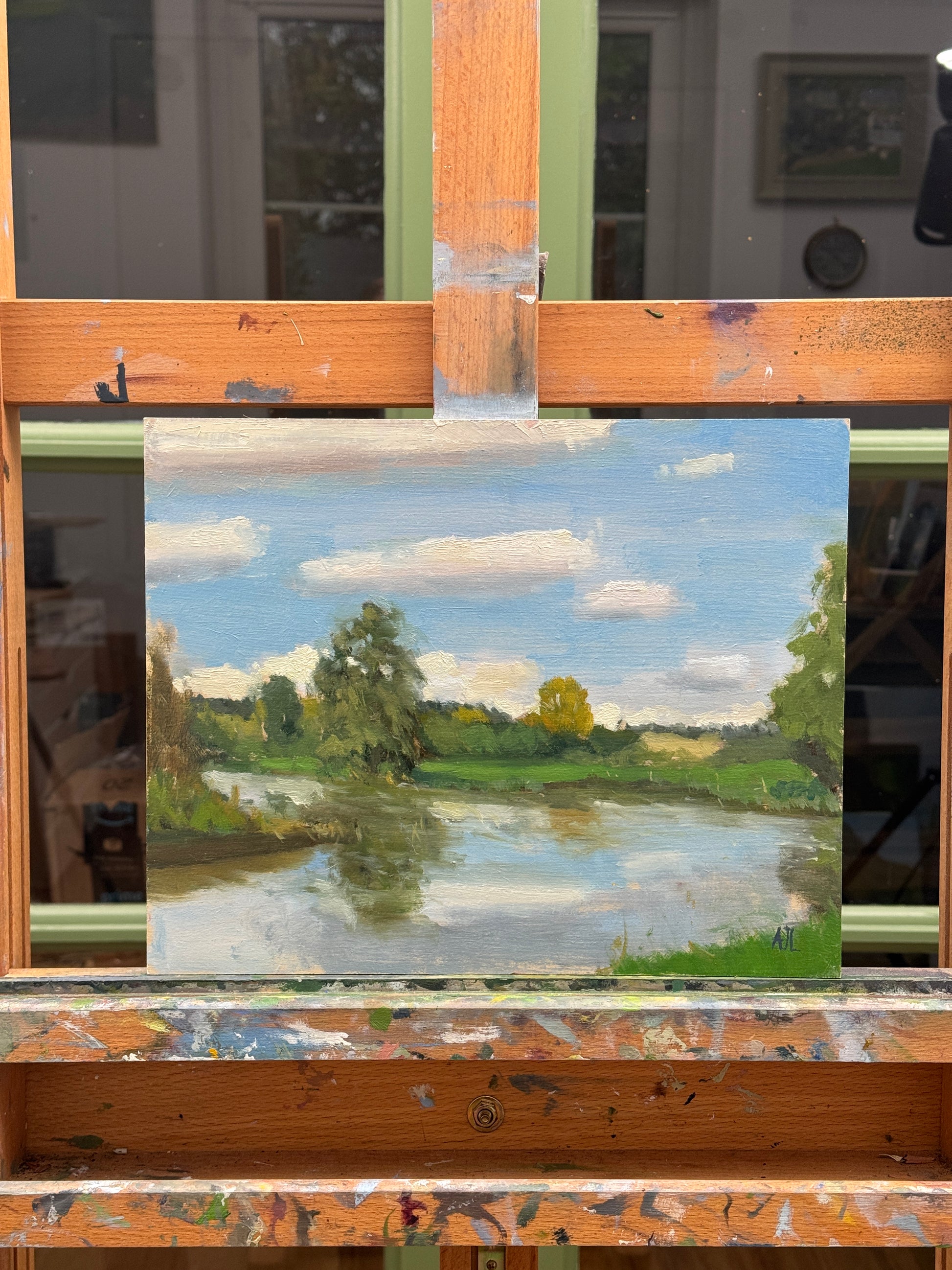 The oil painting on the artist easel.