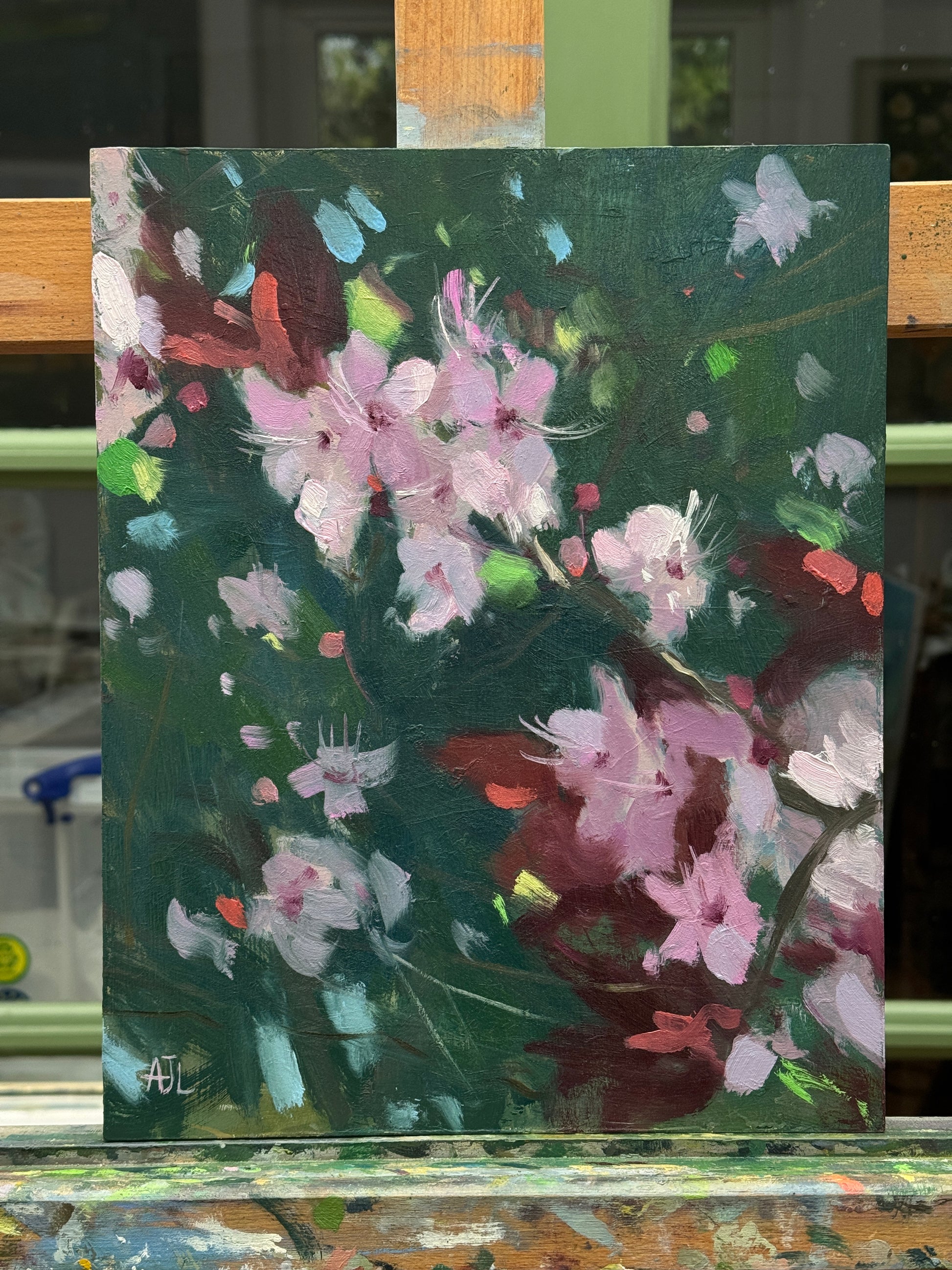The artwork sitting on the artist easel.
