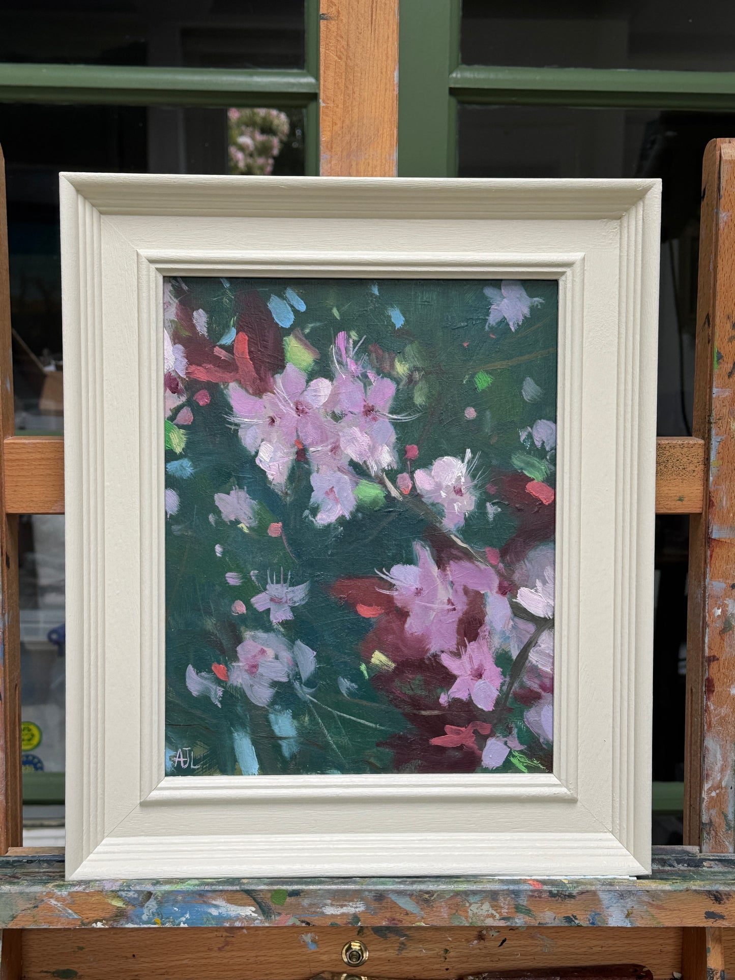 The framed oil painting.