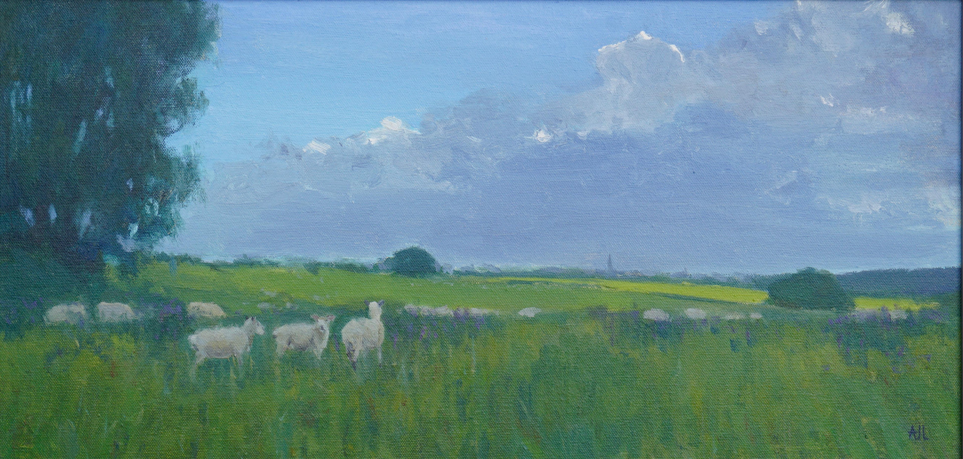 an original oil painting of a flock of sheep on a green field, most looking towards the horizon and soft, fluffy clouds in a blue sky. The artist has signed AJL, for "Alex James Long", at the bottom right of the artwork. 