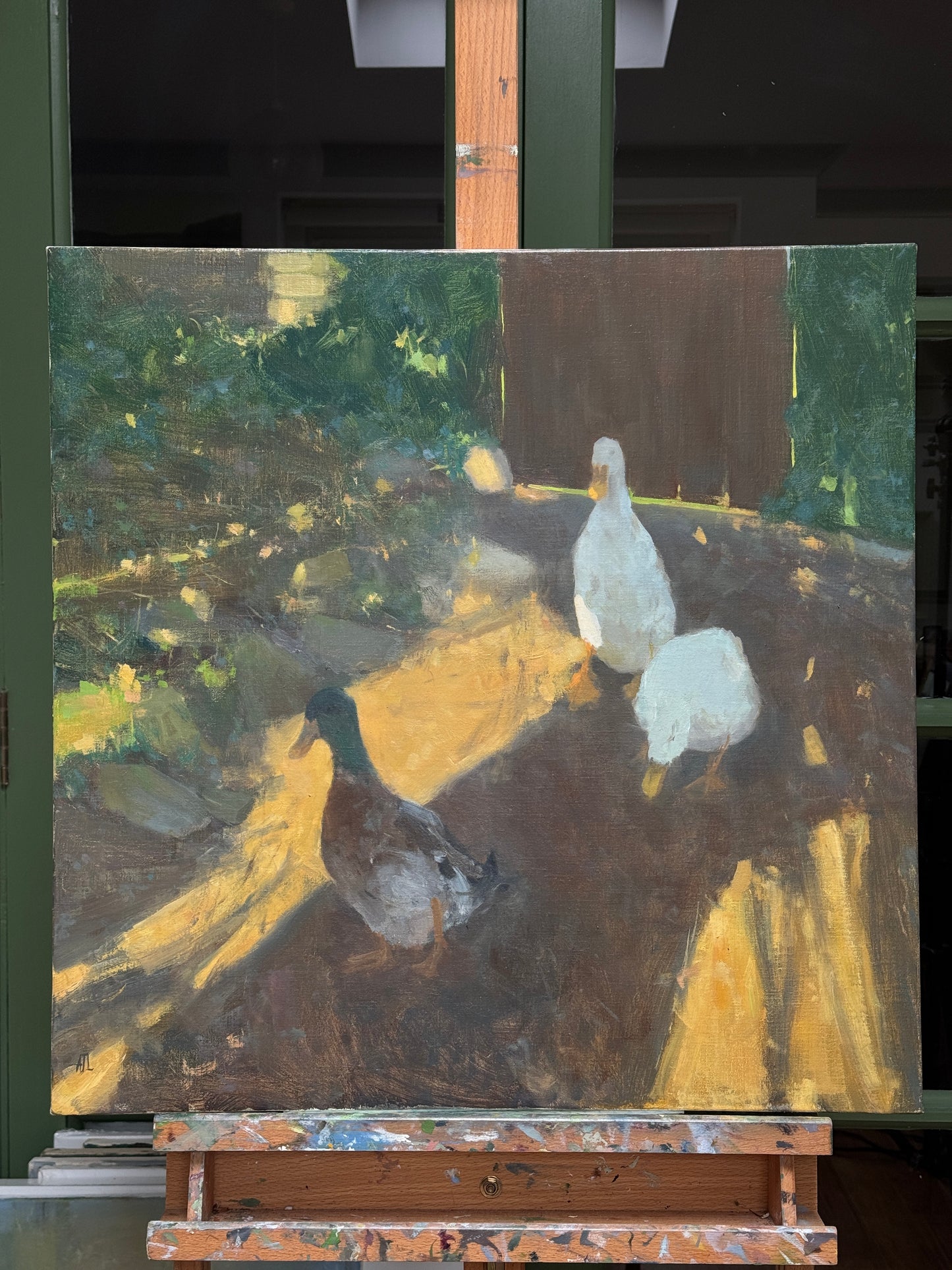 The original painting on the artist easel, front view.