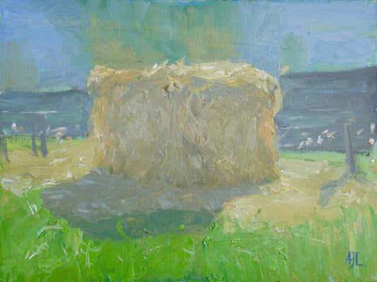 An original oil painting centred around a rectangular haystack casting a strong shadow to the left. The artist has signed AJL in blue, for "Alex James Long", at the bottom right of the artwork. 