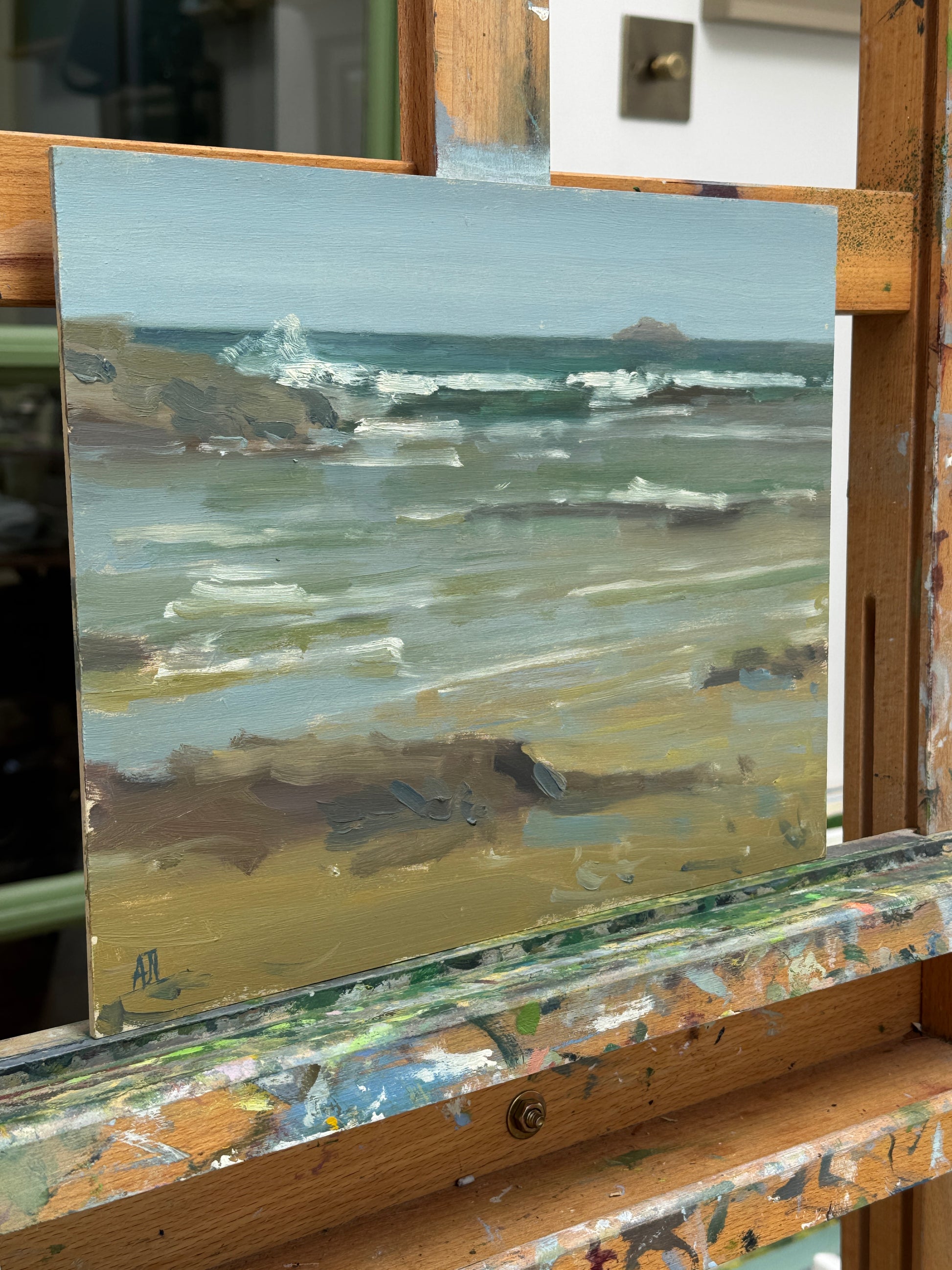 A side view of the artwork on the artist easel.