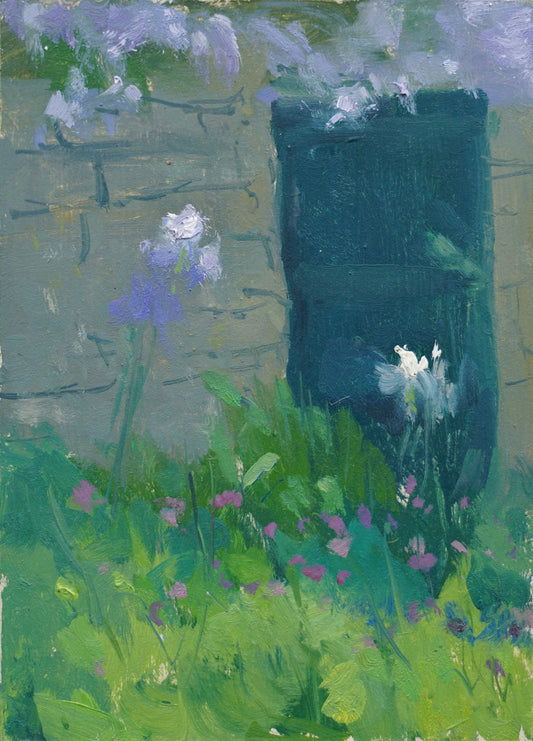 An original oil painting of a Cotswold stone wall with a closed deep turquoise wood door. Purple wisteria is on top o the wall, bright pink cyclamen bloom below in the grass and tall blue and white irises take the foreground of the painting. 