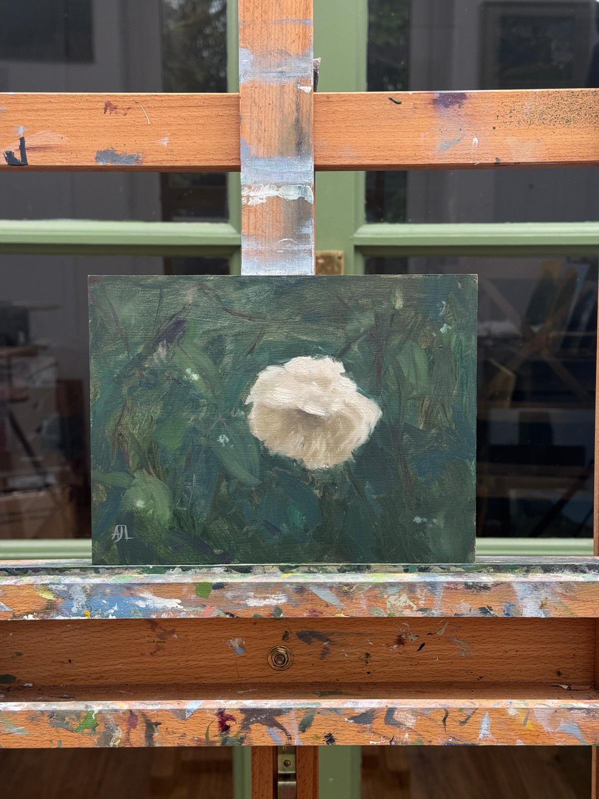 A frontal view of the painting on the artist easel.