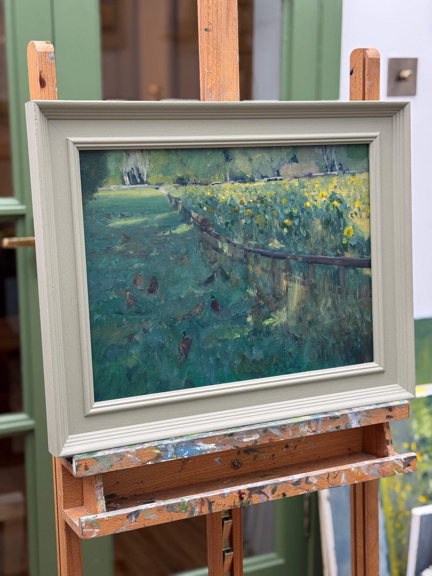 The original oil painting on an easel as seen from the side.
