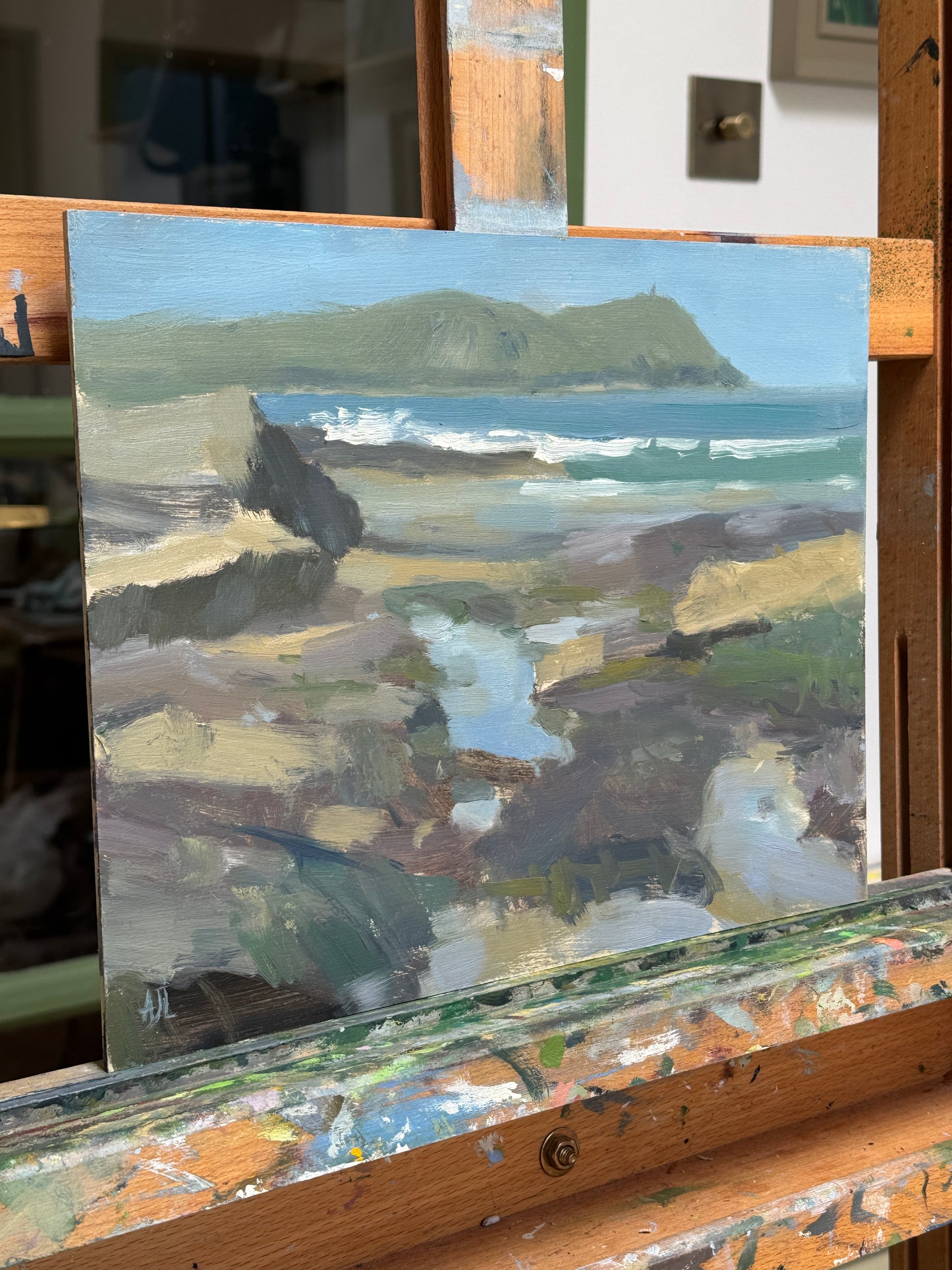 The original artwork photographed from the side as it rests on the artist easel.