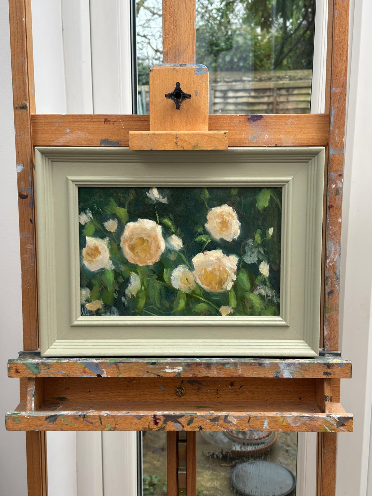 The original artwork in a frame on the artist easel.