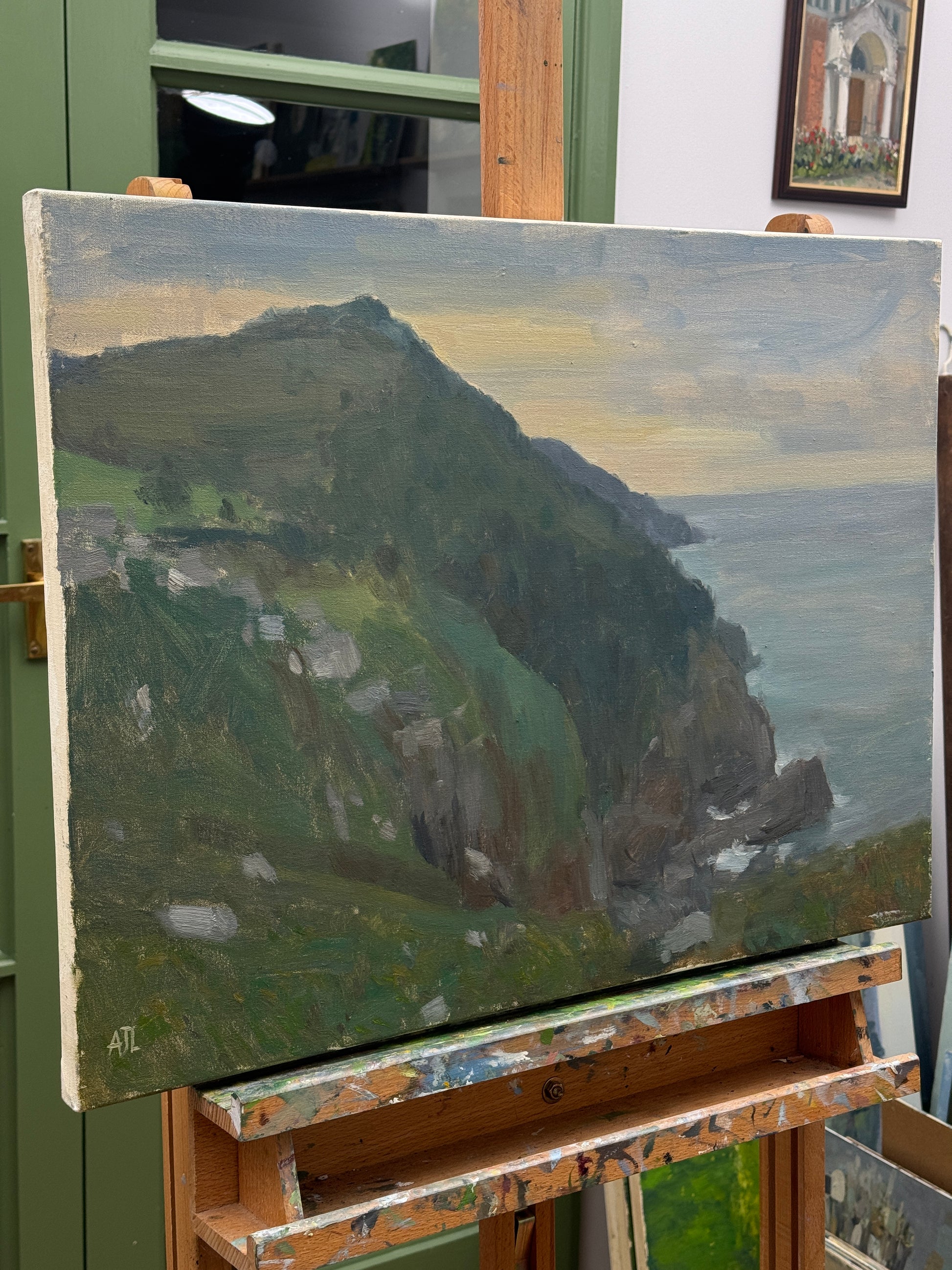 The painting on the artist easel.