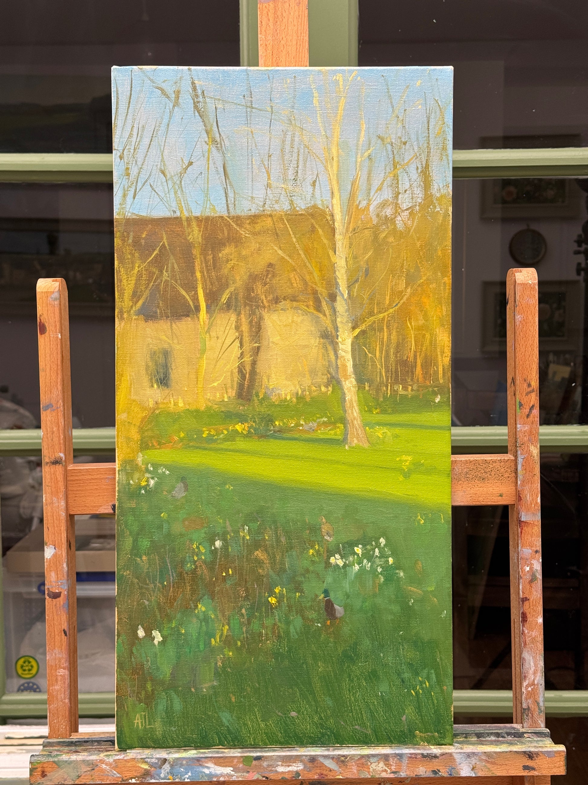 The original oil painting on the artist easel.
