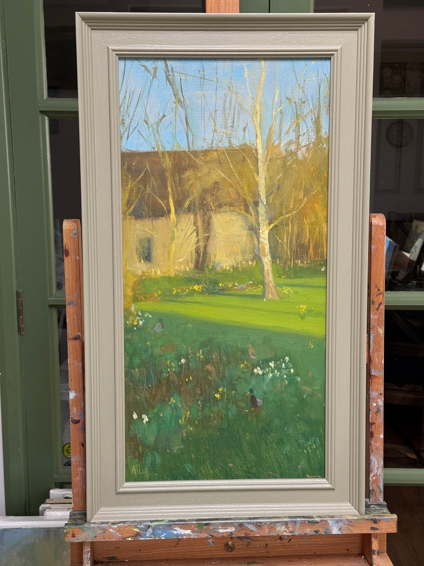 The artwork in a wooden frame.