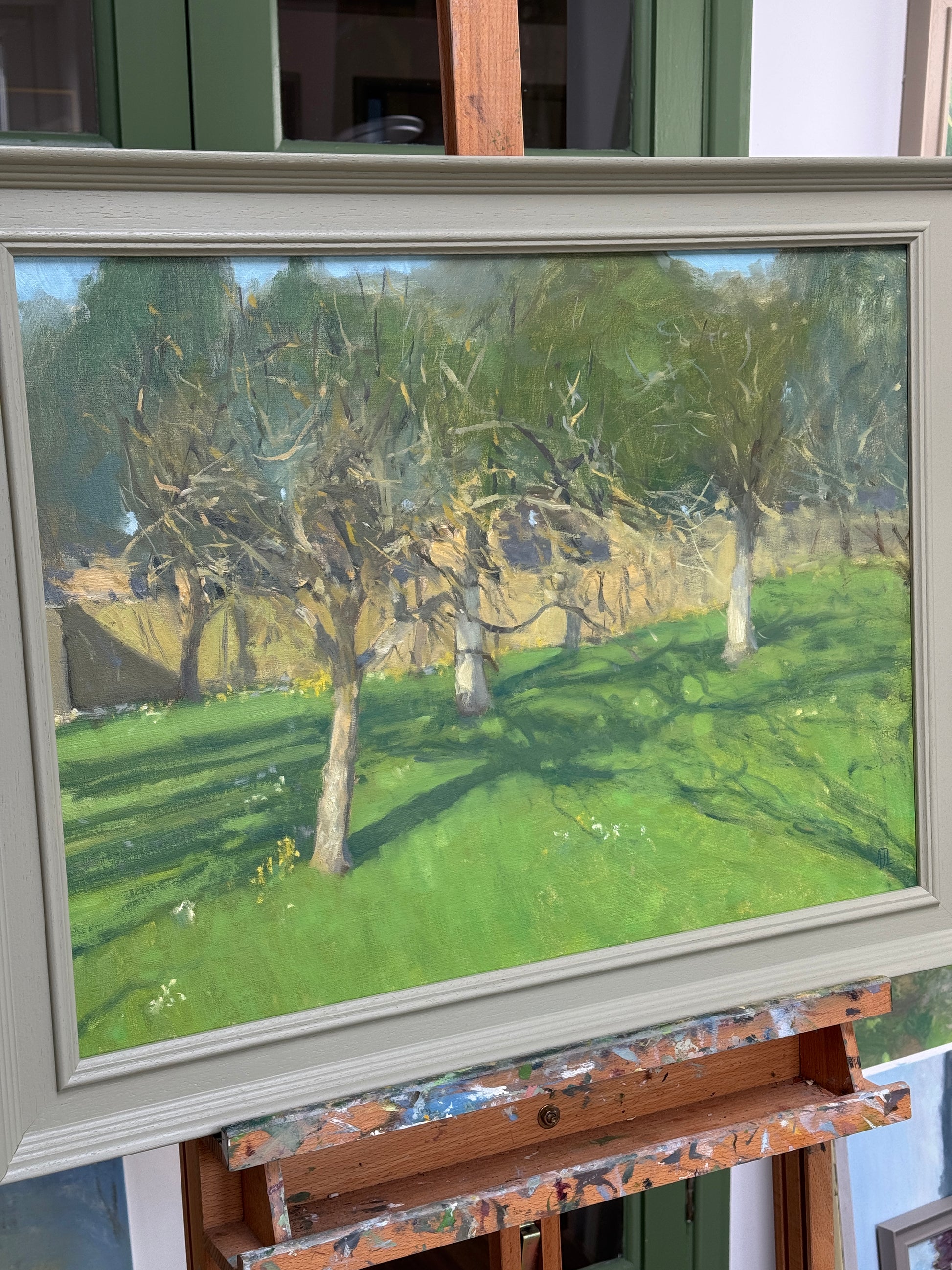 The framed artwork, photographed from the side.