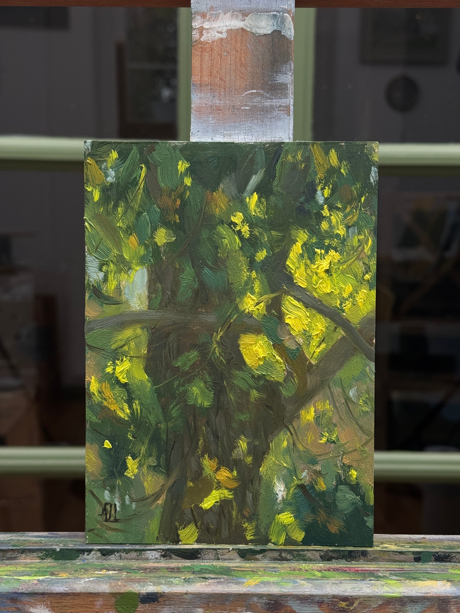 The artwork photographed from the front, on the artist easel.