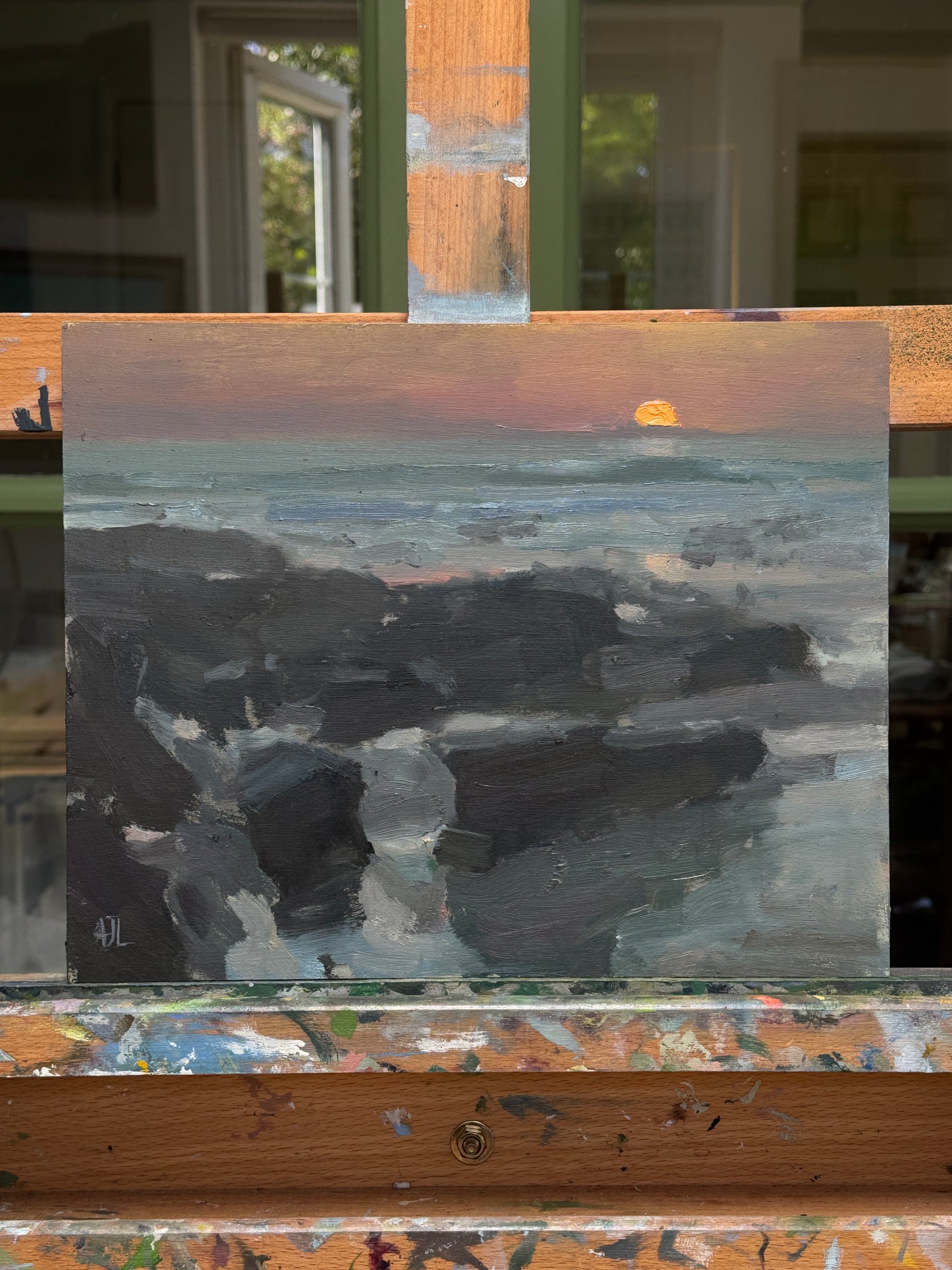 The artwork resting on the artist easel.