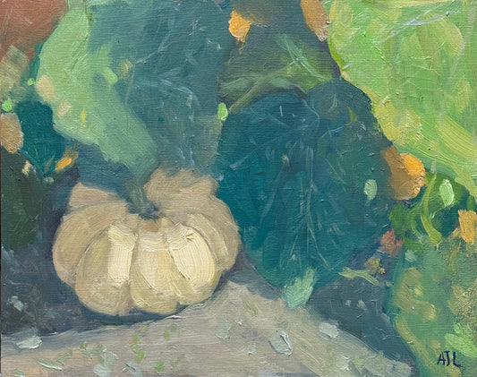 An original oil painting of a small yellow pumpkin growing under large green leaves in an autumnal pumpkin patch.