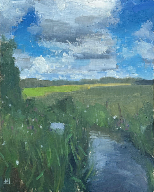 An original oil painting of a landscape with green fields, trees, a river and a blue sky.