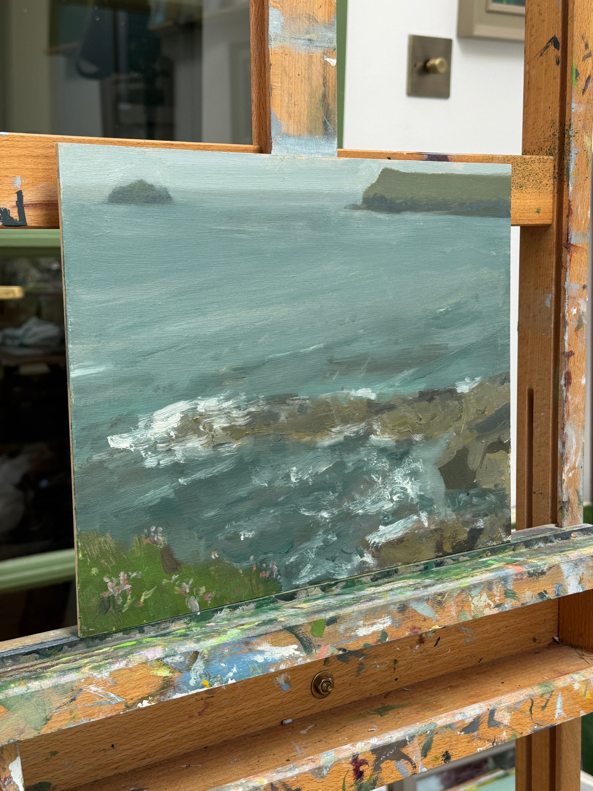 A side view of the artwork on the artist easel.