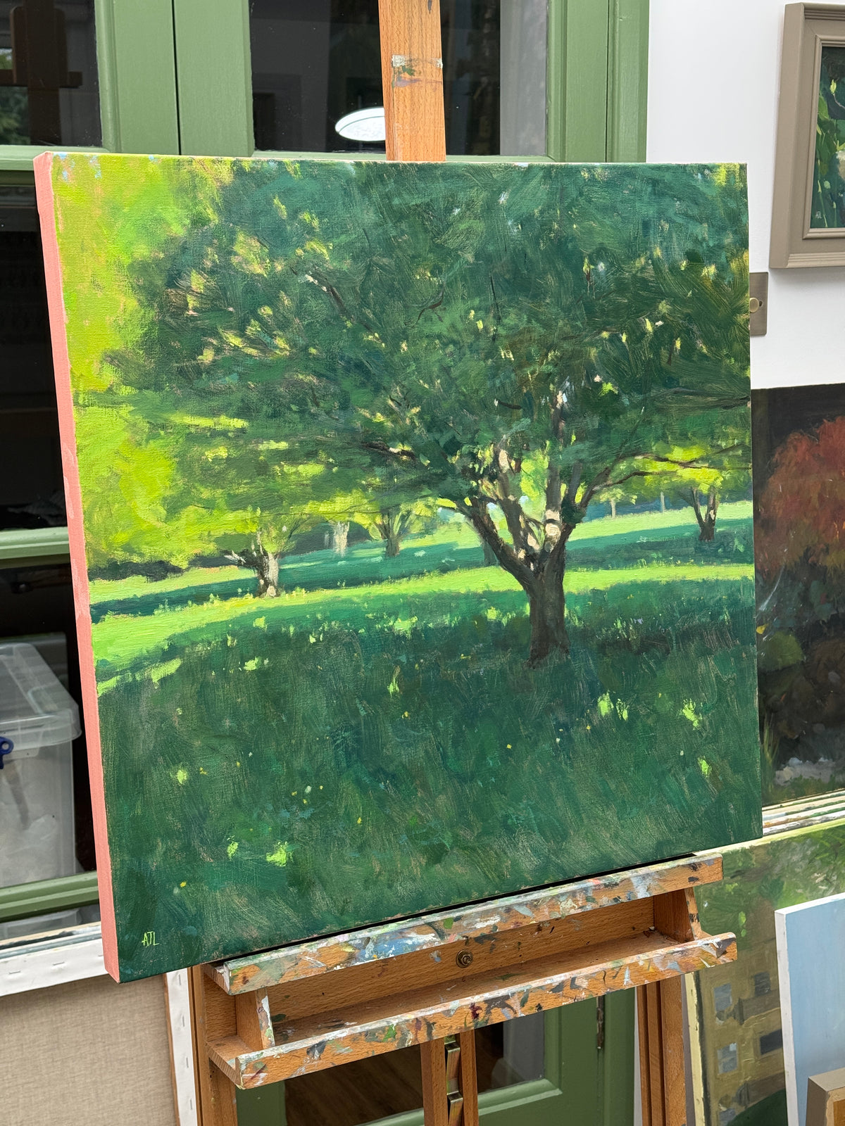 The unframed painting from a side view.