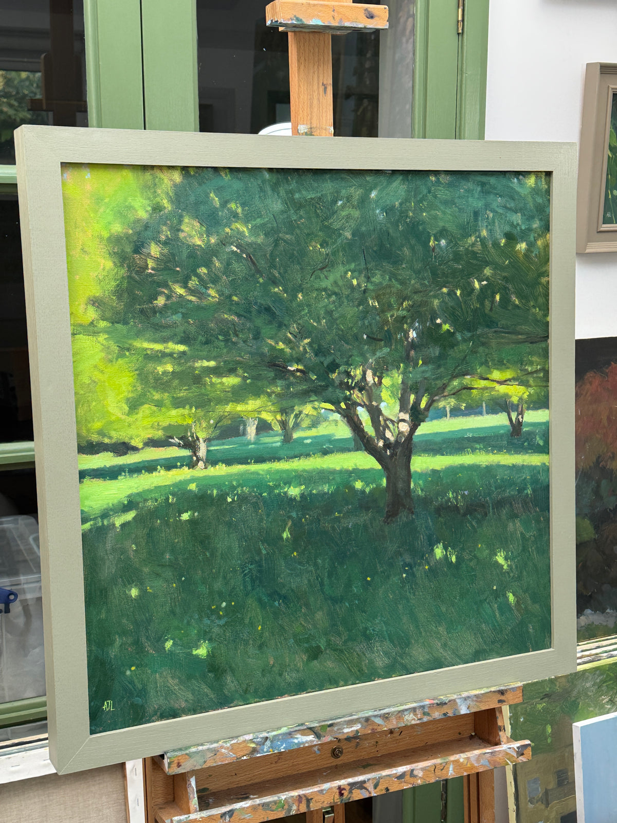 The framed painting as seen from a side view.