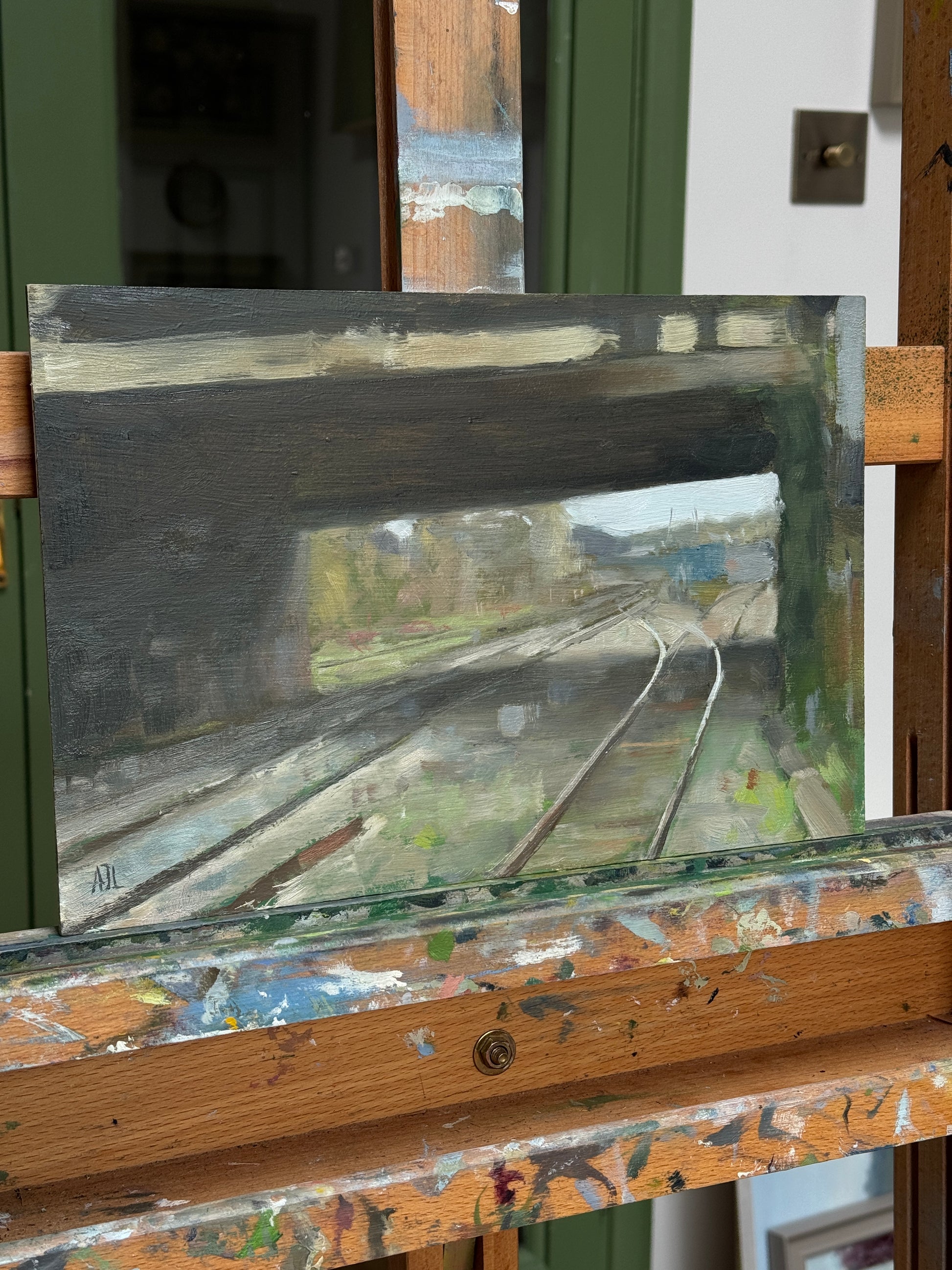The painting on an artist easel.