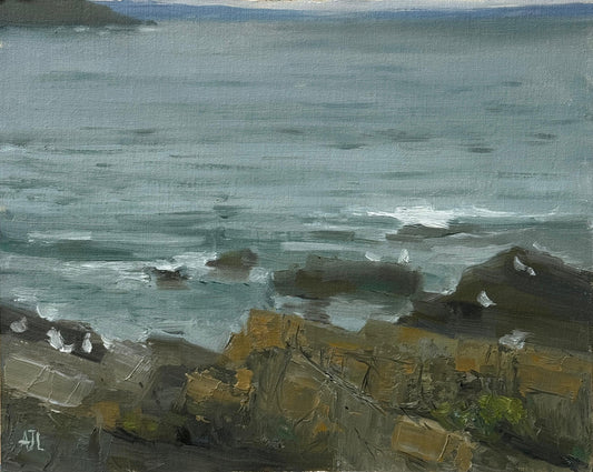 An original oil painting of a coastal scene with rocks and water in Wales.