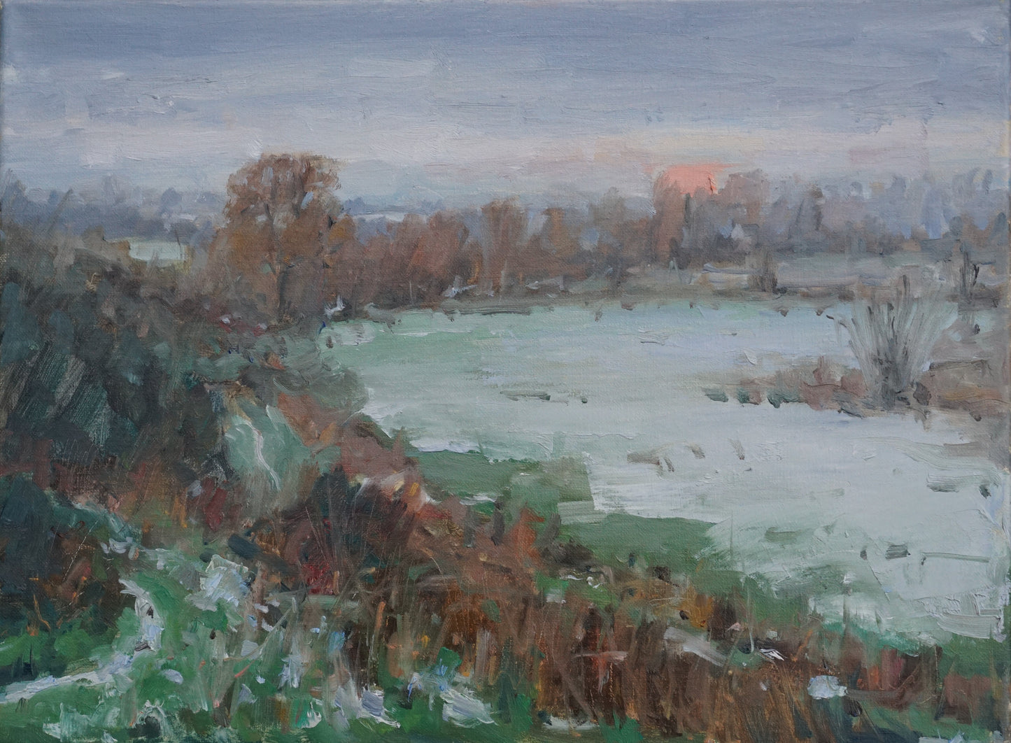 An original oil painting of a field in the wintertime, with an orange setting sun in the background and fresh snow in the foreground. 