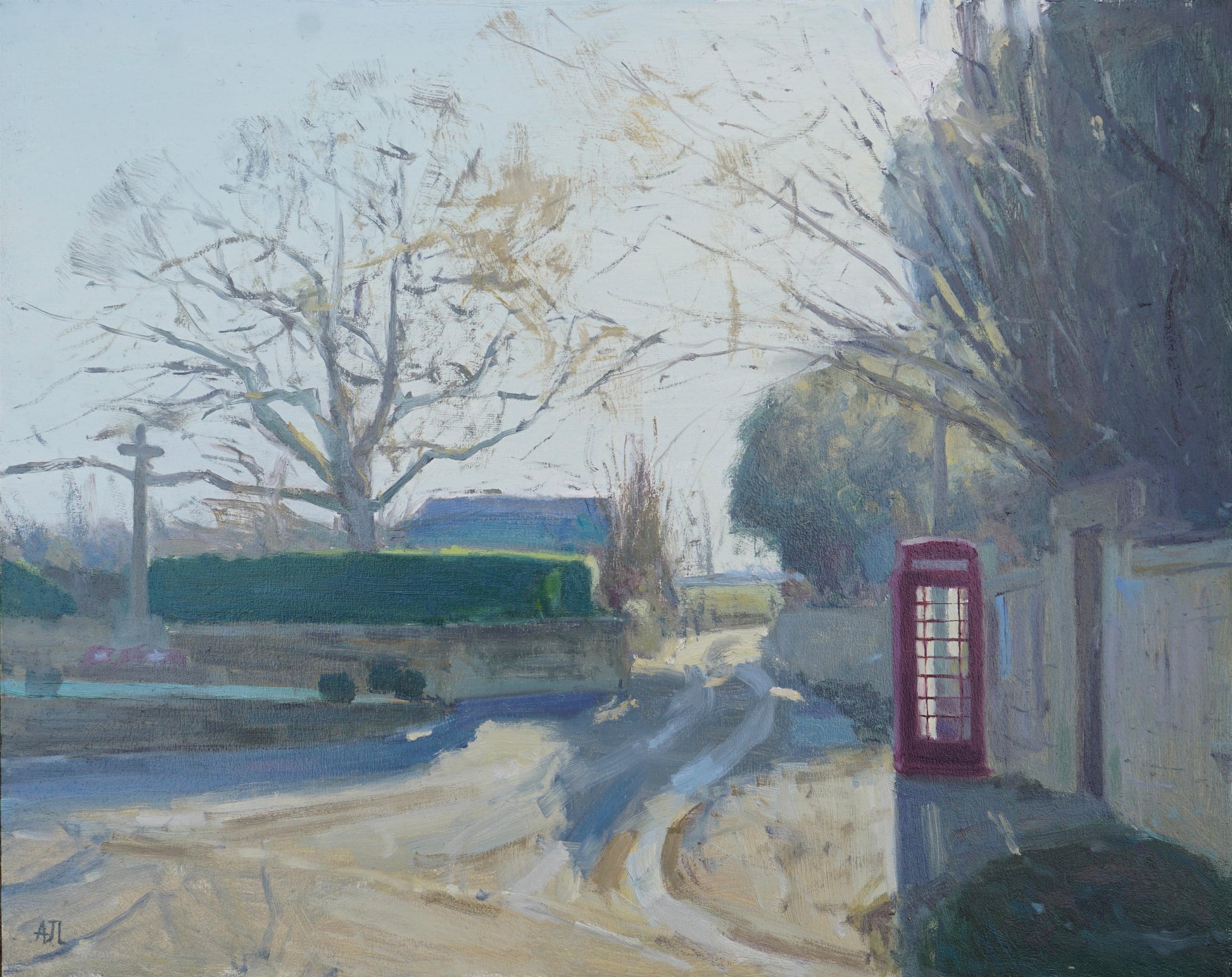 An original oil painting of a quiet winter street corner in the village of Sherborne, with a war memorial on one side of the street and a red phone box by a tall Cotswold stone wall on the other. The artist has signed AJL, for "Alex James Long", at the bottom left of the artwork. 