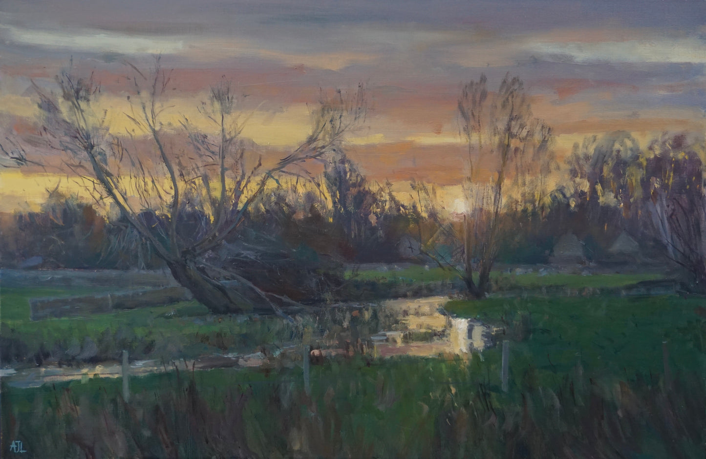 An original oil painting of the River Windrush just as the sun sets above a shadowy line of trees; the vibrant colours of the sky are reflected in the winding river below. The artist has signed AJL in blue, for "Alex James Long", at the bottom left of the artwork.