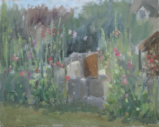 Oil painting depicting a cottage garden full of hollyhocks