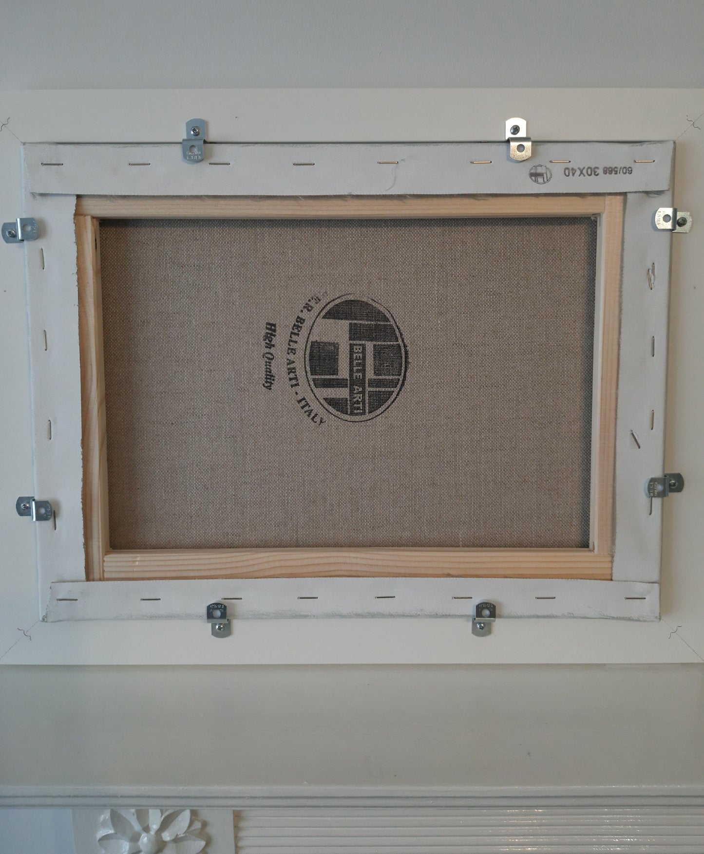 The reverse of the framed oil painting.