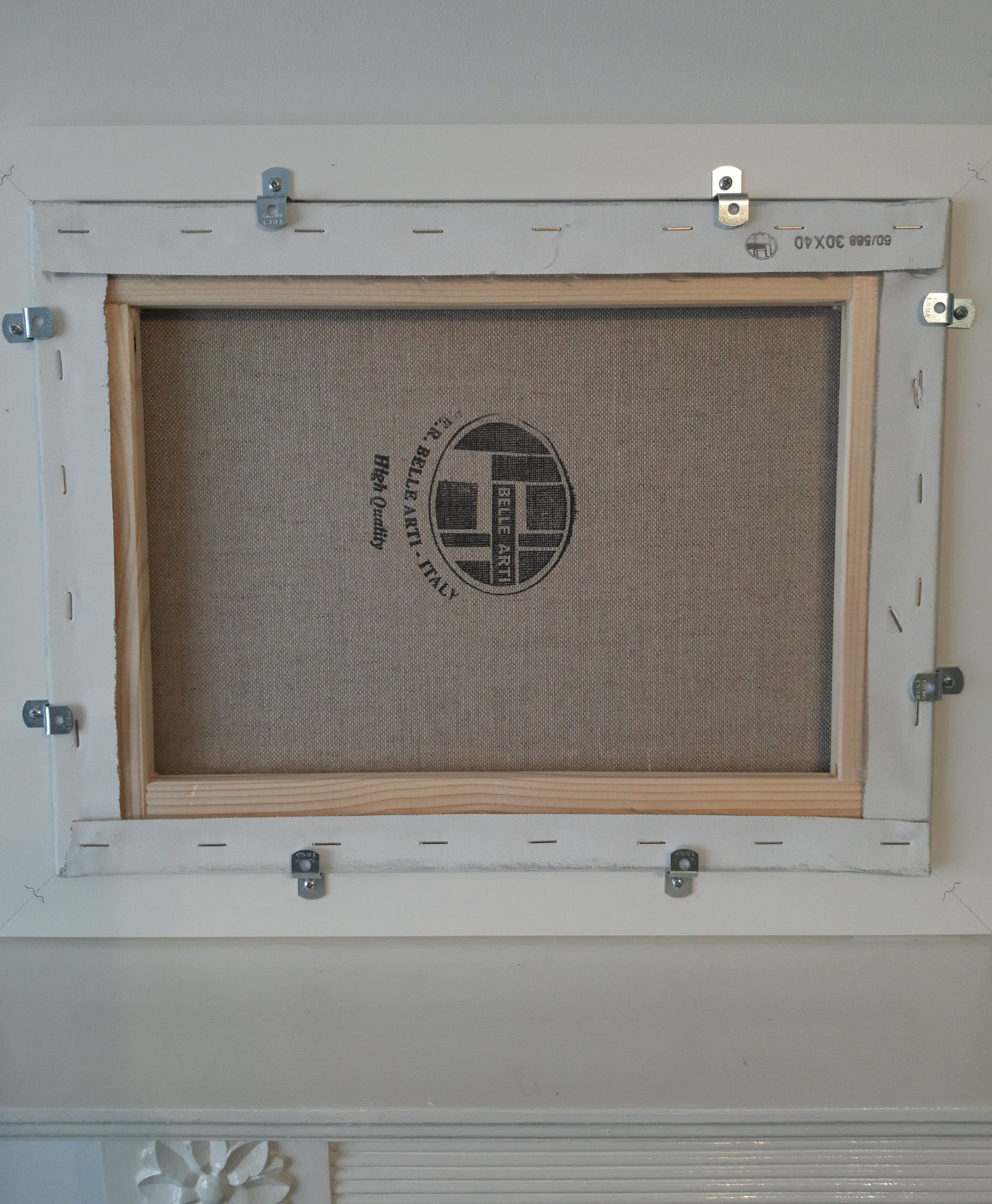 The reverse of the framed oil painting.